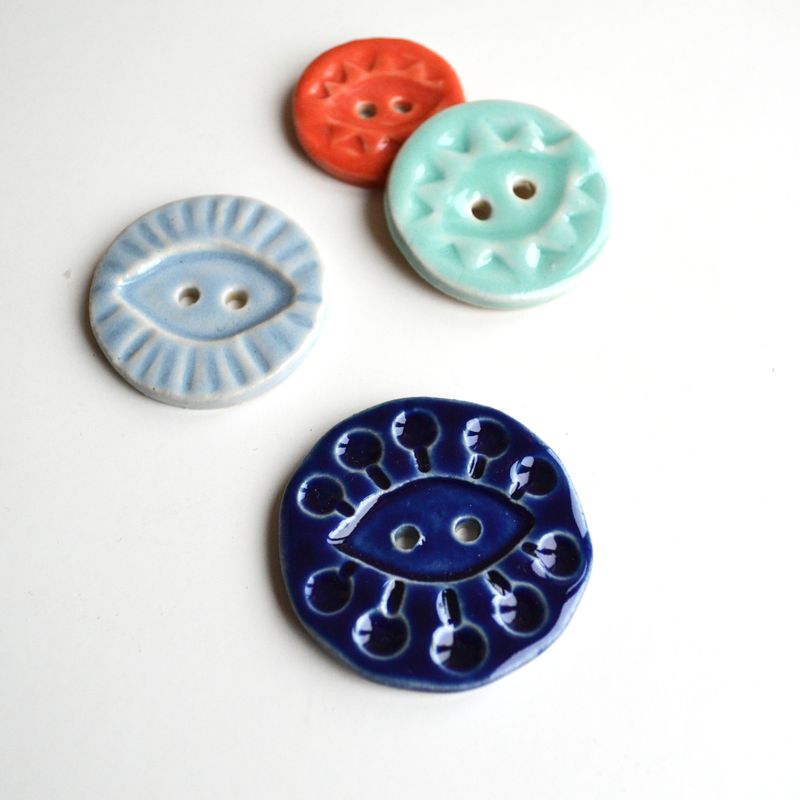 Four_A_Alicia_buttons_on_white